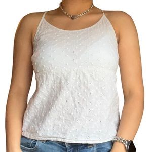 White tank top from the brand Arizona Jeans! It also has a floral sewn pattern.
